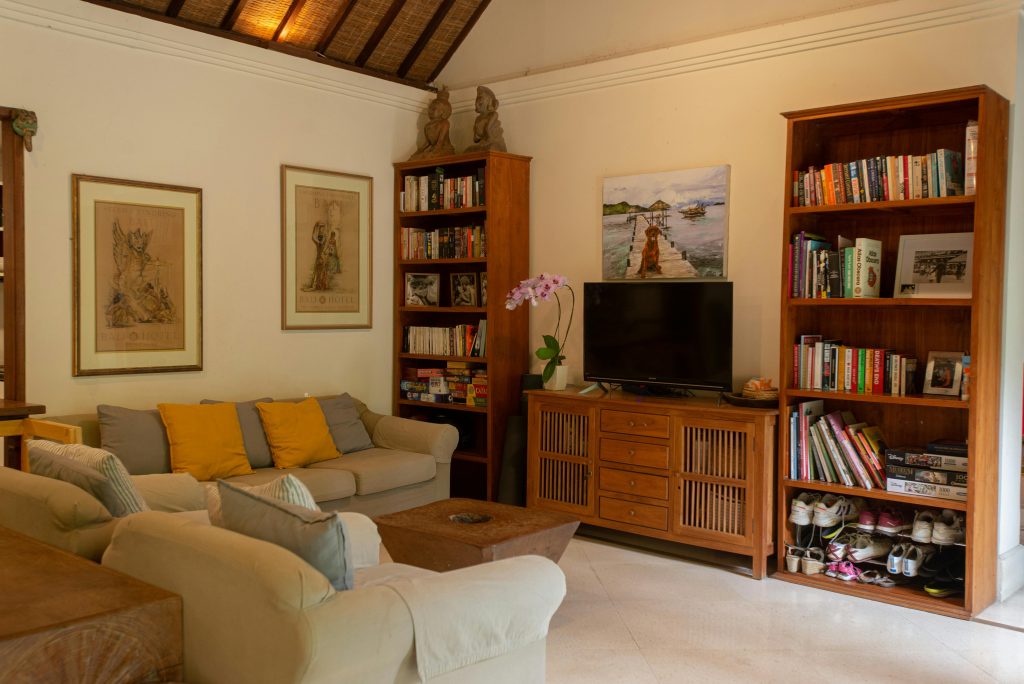 Warm and inviting living room in a Balinese villa featuring traditional decor.